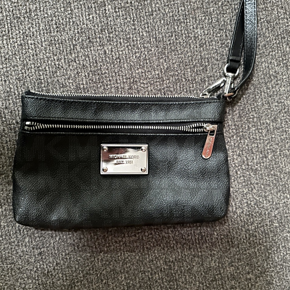Michael Kors small black clutch, good condition used once.